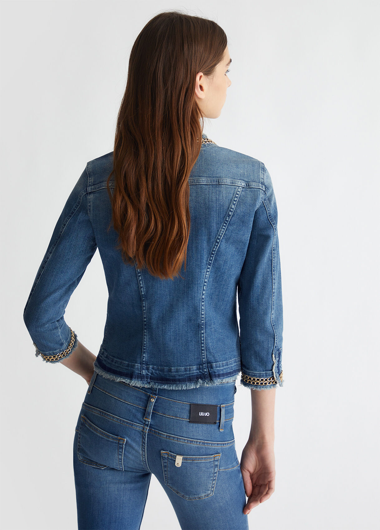 Denim jacket with shop chains on back
